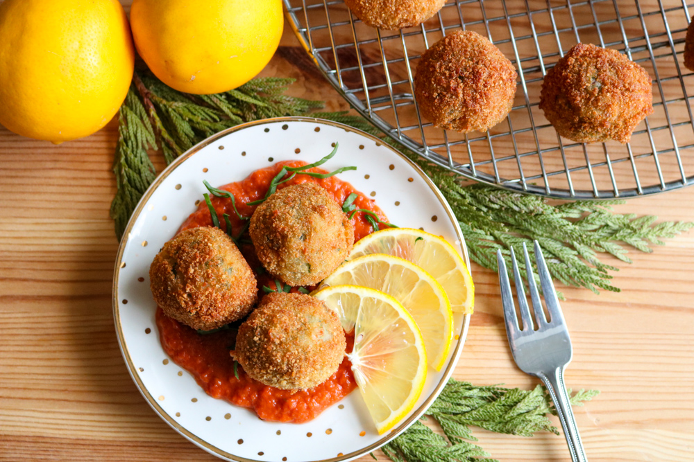 Plated-Arancini-4932 JLOkitchens lifestyle image of Italian Arancini on a small plate with lemon silces